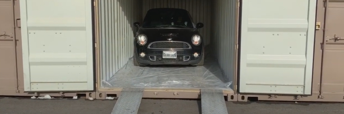 a small black car in a self-storage unit at Storage Solutions